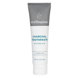 Charcoal hydroxyapatite natural toothpaste in a fluoride-free whitening mint formula by Wellnesse, displayed on a white background