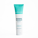 Natural teeth whitening toothpaste in a Wellnesse tube with a turquoise top and white body, labeled fluoride-free fresh mint.