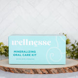 Dental care kit by Wellnesse in aqua packaging, labeled Mineralizing Oral Care Kit for whitening, detox, and strengthening teeth
