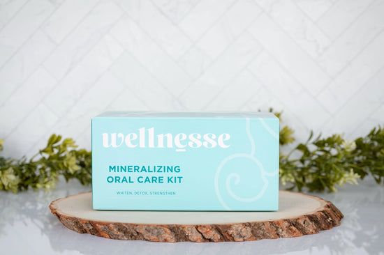 Dental care kit by Wellnesse in aqua packaging, labeled Mineralizing Oral Care Kit for whitening, detox, and strengthening teeth
