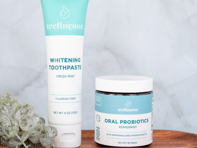 Probiotics for the mouth by Wellnesse shown with fluoride-free whitening toothpaste, formulated to support oral health and fresh breath.