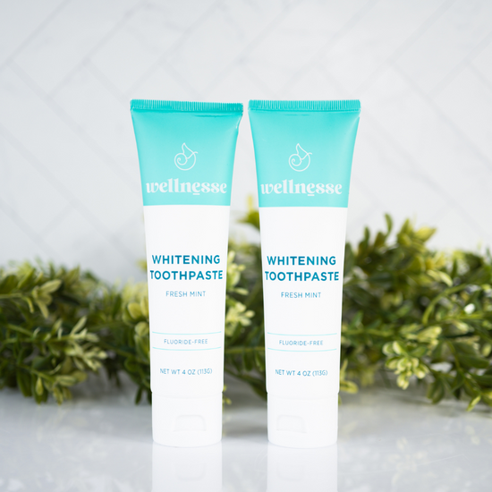 Best non toxic whitening toothpaste options from Wellnesse, including fresh mint, charcoal mint, and children's strawberry fluoride-free formulas.