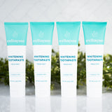 Natural teeth whitening toothpaste in fresh mint flavor, fluoride-free and displayed in a pack of four by Wellnesse.