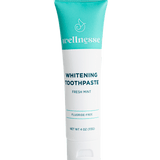 Fluoride free whitening toothpaste in a turquoise and white Wellnesse tube labeled fresh mint, 4 oz.