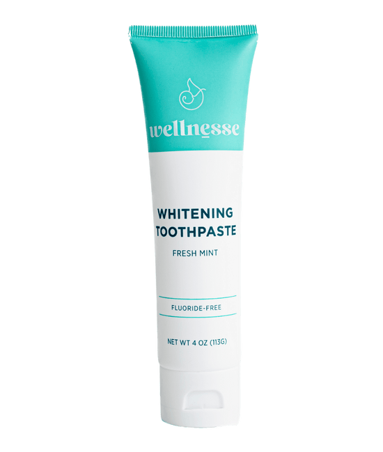 Fluoride free whitening toothpaste in a turquoise and white Wellnesse tube labeled fresh mint, 4 oz.