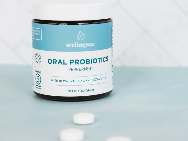 Probiotics for oral health shown in a peppermint-flavored Wellnesse bottle