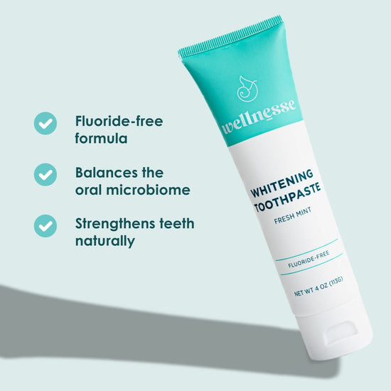 Natural teeth whitening toothpaste tube with fluoride-free formula, shown with benefits like enamel strengthening and oral microbiome balance.