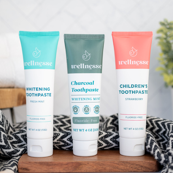 Best non toxic whitening toothpaste options from Wellnesse, including fresh mint, charcoal mint, and children's strawberry fluoride-free formulas.
