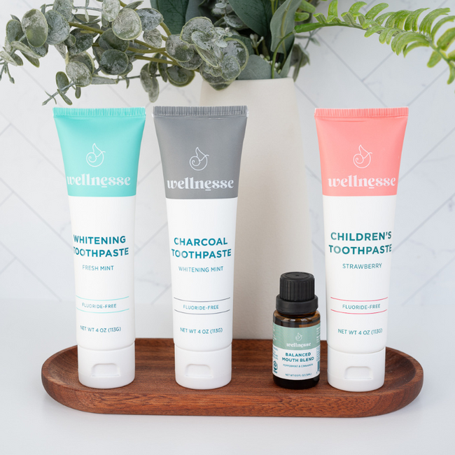 Best non toxic whitening toothpaste options from Wellnesse, including fresh mint, charcoal mint, and fluoride-free children's strawberry formulas with mouth blend.