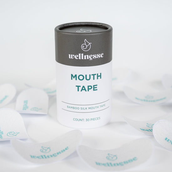 Silk mouth tape by Wellnesse made from soft bamboo silk, shown in a 30-piece pack designed for gentle overnight use to support nasal breathing and improve sleep quality.