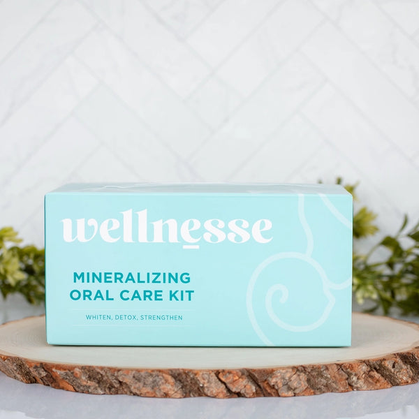 Wellnesse oral care kit in aqua packaging labeled for whitening, detox, and strengthening teeth