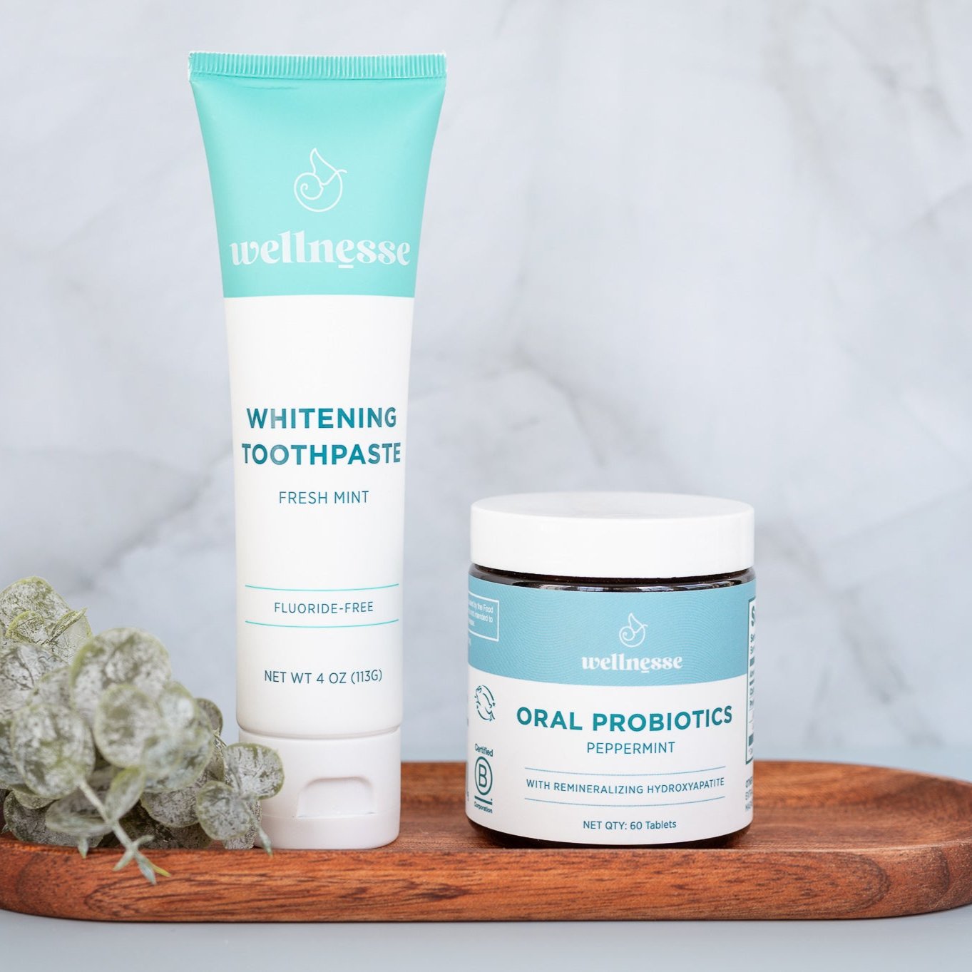 Probiotics for the mouth by Wellnesse shown with fluoride-free whitening toothpaste, formulated to support oral health and fresh breath.