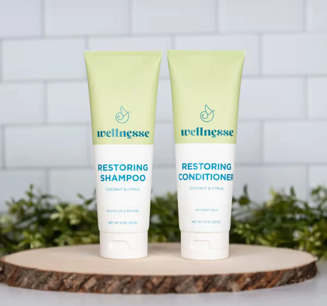 Wellnesse restoring shampoo and conditioner duo in coconut citrus scent displayed as a gift set