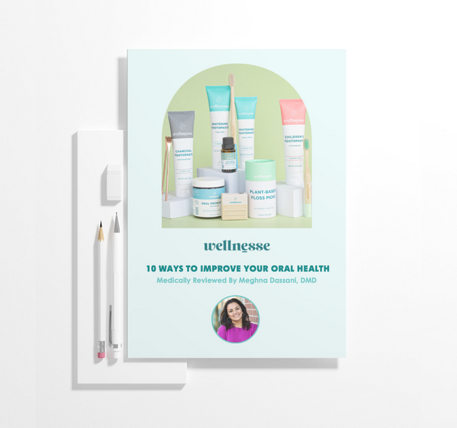 Wellnesse 10 Ways to Improve Your Oral Health e-book cover featuring natural toothpaste, floss picks, and oral care products.
