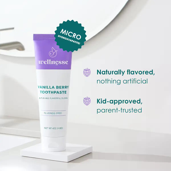 Wellnesse vanilla toothpaste with purple cap and micro hydroxyapatite badge, fluoride-free formula