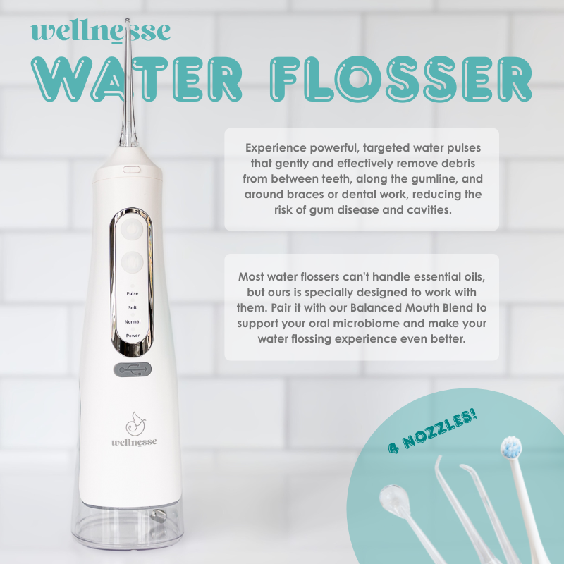 Water flosser by Wellnesse with 4 nozzles, designed for use with essential oils to support oral health.