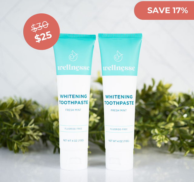 Whitening mint toothpaste by Wellnesse, fluoride-free and displayed in a discounted twin pack with a "Save 17%" label.