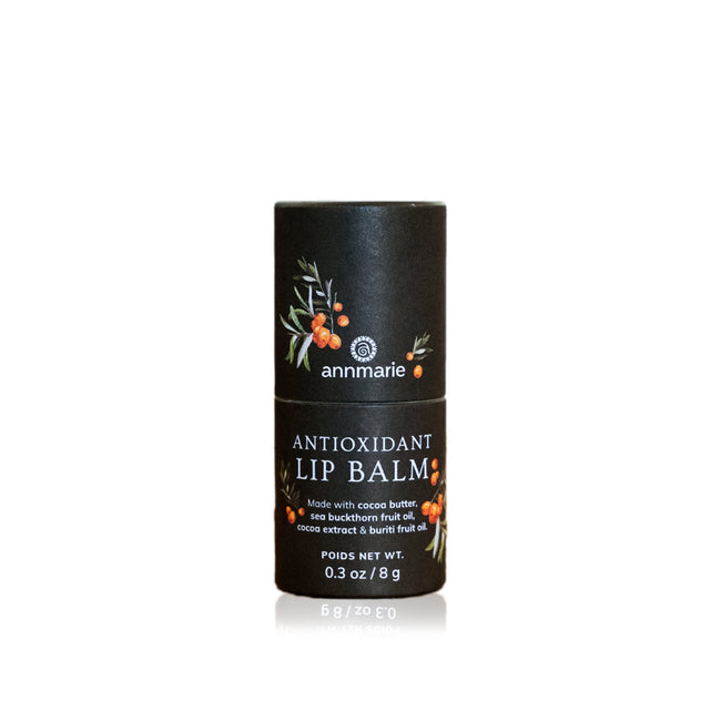 Antioxidant Lip Balm tube with sea buckthorn berry illustrations, made with cocoa butter and buriti oil